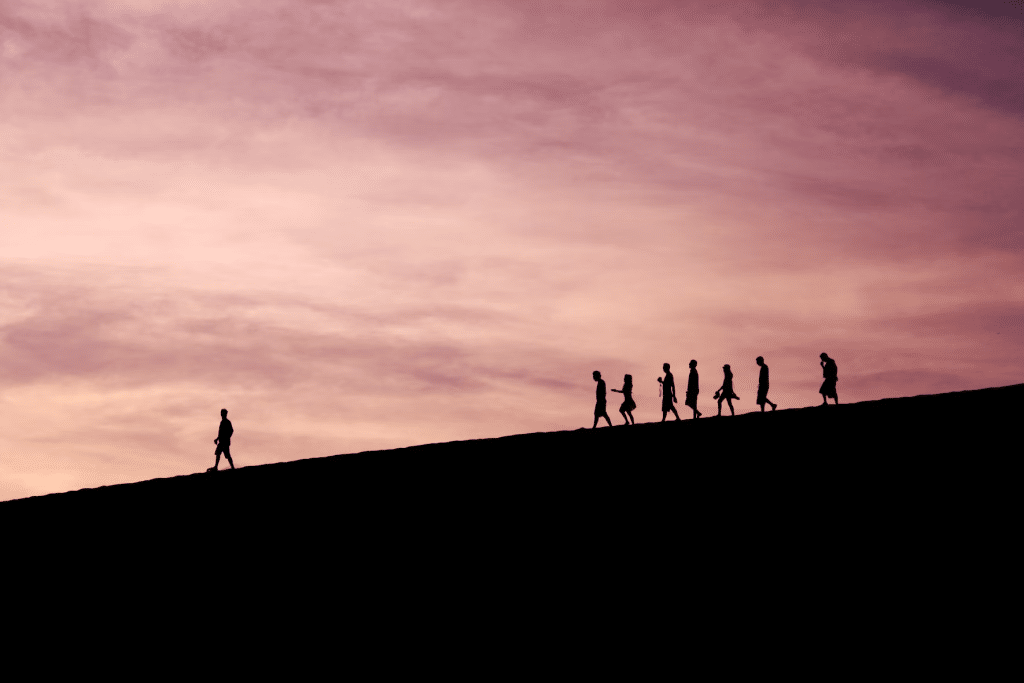 chidren following a teacher